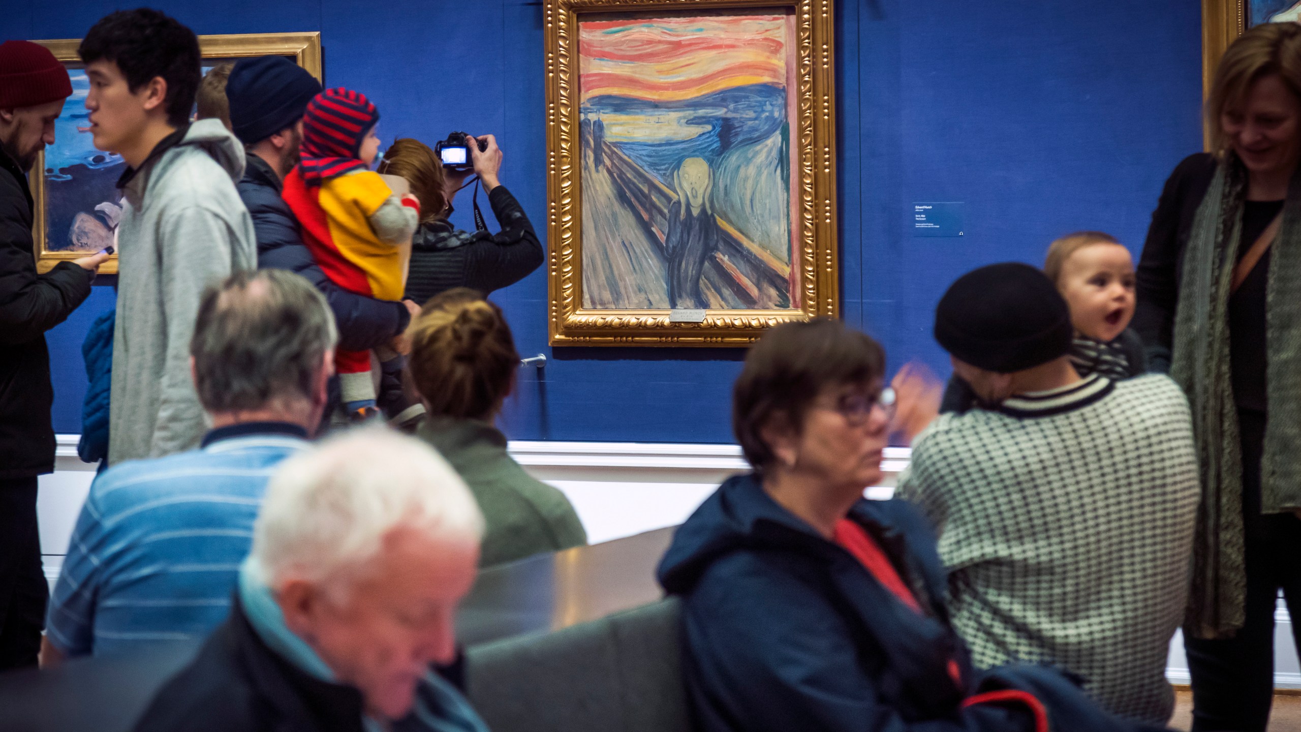 People look at Edvard Munch's "The Scream" at the National Gallery in Oslo, Norway, Sunday Jan. 13, 2019. On Friday, Nov. 11, 2022, activists from the organization ''Stopp oljeletinga'' (Stop Oil Exploration) tried to glue themselves to the frame of the painting. (Heiko Junge/NTB Scanpix via AP, file)