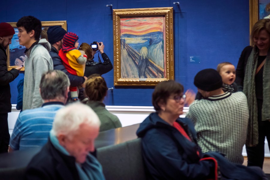 People look at Edvard Munch's "The Scream" at the National Gallery in Oslo, Norway, Sunday Jan. 13, 2019. On Friday, Nov. 11, 2022, activists from the organization ''Stopp oljeletinga'' (Stop Oil Exploration) tried to glue themselves to the frame of the painting. (Heiko Junge/NTB Scanpix via AP, file)