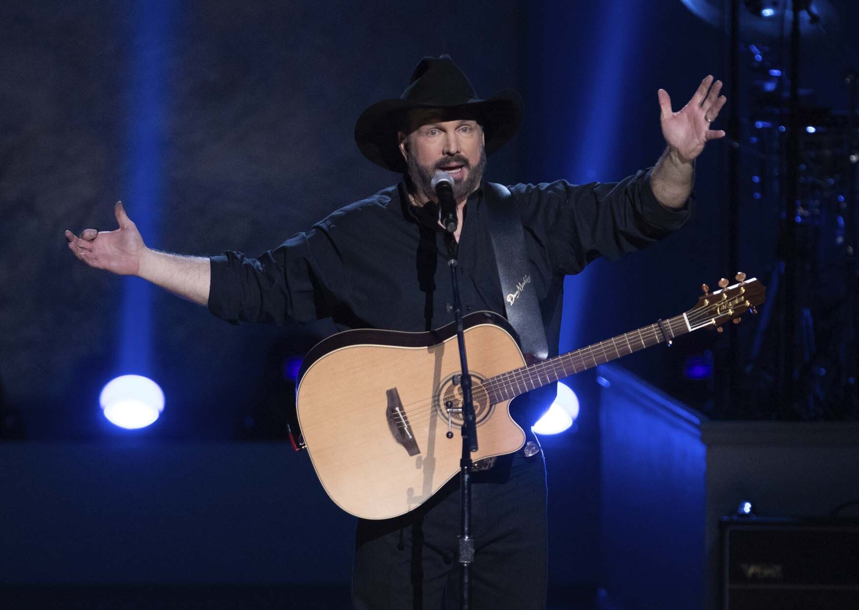 In this March 4, 2020, file photo, country star Garth Brooks performs on stage during the 2020 Gershwin Prize Honoree's Tribute Concert at the DAR Constitution Hall in Washington. (Brent N. Clarke/Invision/AP)