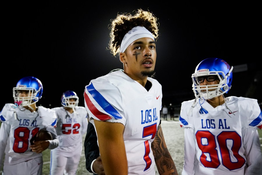 Los Alamitos High School quarterback Malachi Nelson stands on the field after a high school football game against Newport Harbor High School on Friday, Sept. 30, 2022, in Newport Beach, Calif. (AP Photo/Ashley Landis)