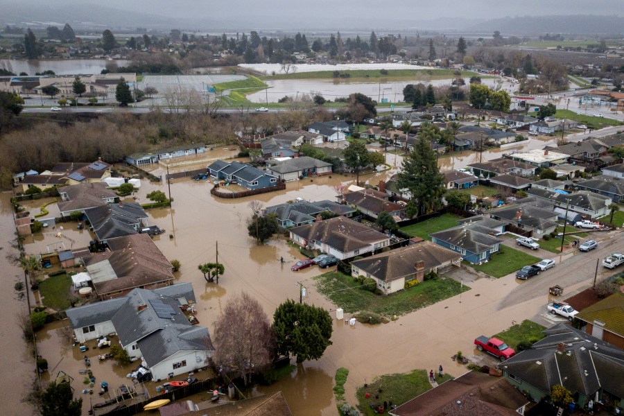 Flooding from huge amounts of rain are seen in a neighborhood off of Holohan Road near Watsonville, Calif. on Monday, Jan. 9, 2023.(Brontë Wittpenn/San Francisco Chronicle via AP)