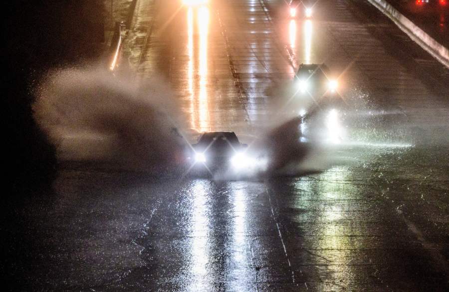 Drivers barrel into standing water on Interstate 101 in San Francisco on Jan. 4, 2023. A bomb cyclone smashed into California on Wednesday bringing powerful winds and torrential rain that was expected to cause flooding in areas already saturated by consecutive storms. (Josh Edelson/AFP via Getty Images)