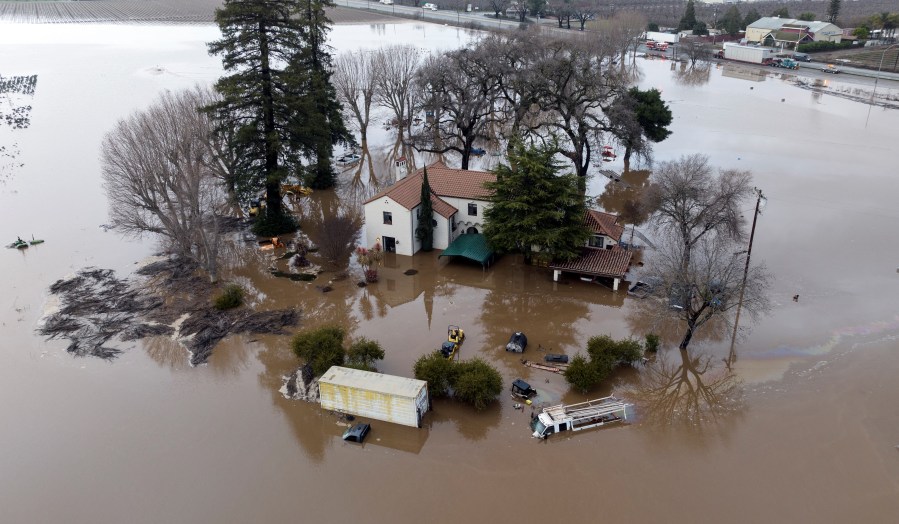 This aerial view shows a flooded home partially underwater in Gilroy, California, on Jan. 9, 2023. (JOSH EDELSON / AFP via Getty Images)