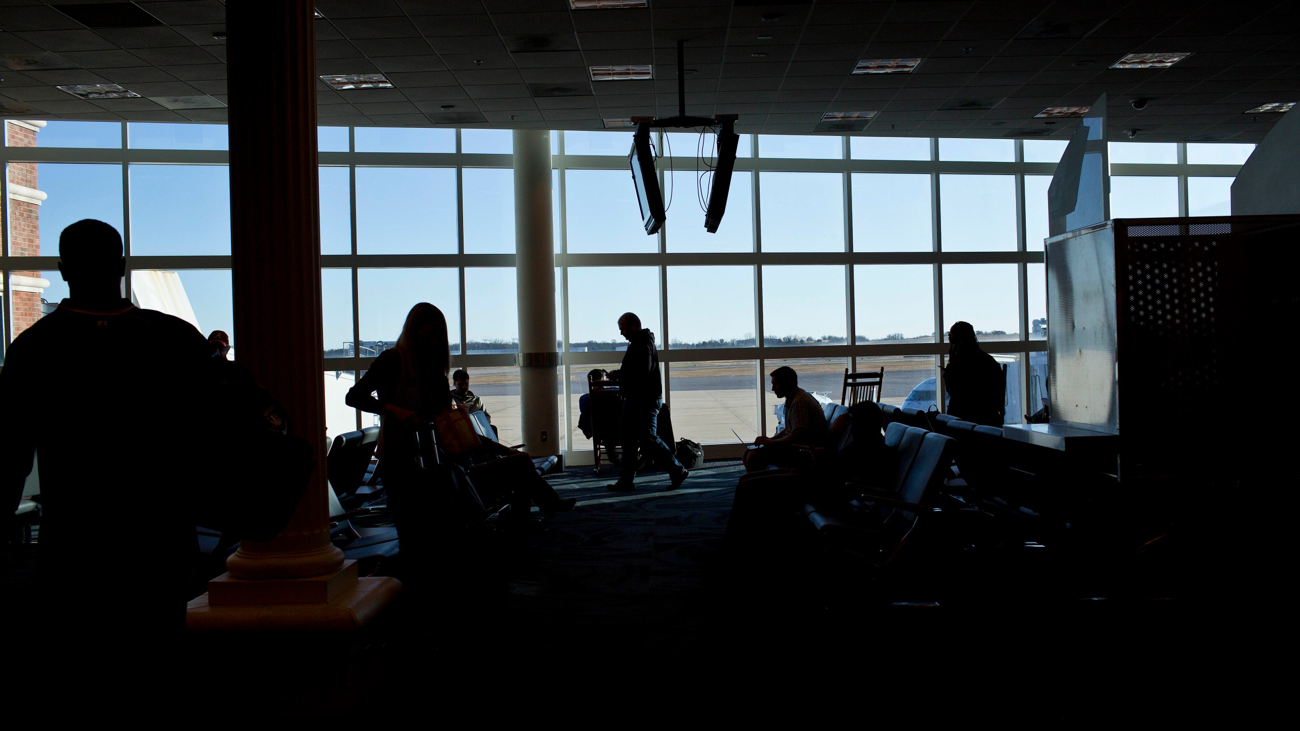 Passengers wait in Montgomery Regional Airport on Nov. 26, 2014, in Montgomery, Ala. A member of an airline ground crew working at the Alabama airport died Saturday afternoon, Dec. 31, 2022, in an accident at the facility. (AP Photo/Brynn Anderson, File)