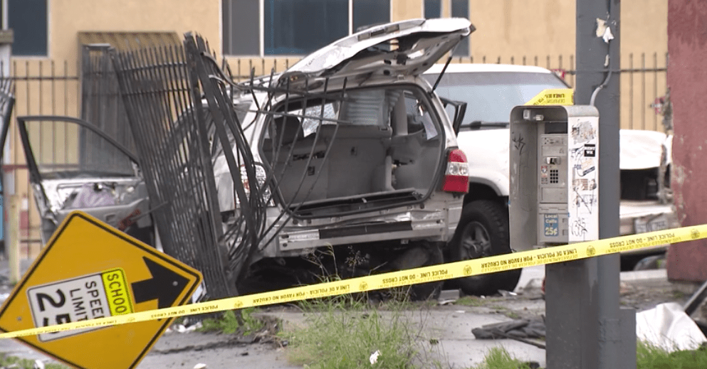 An SUV sustains heavy damage after a high-speed crash that left four injured in South L.A. on Jan. 9, 2023. (KTLA)