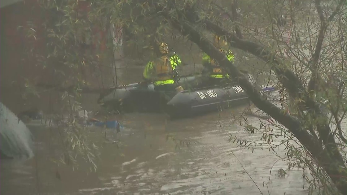 A boat was deployed during a rescue of stranded people at a homeless encampment in the Ventura Riverbed on Jan. 9, 2023. (KTLA)