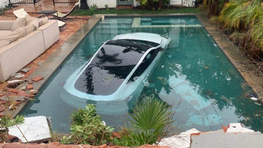 Tesla plunges into pool