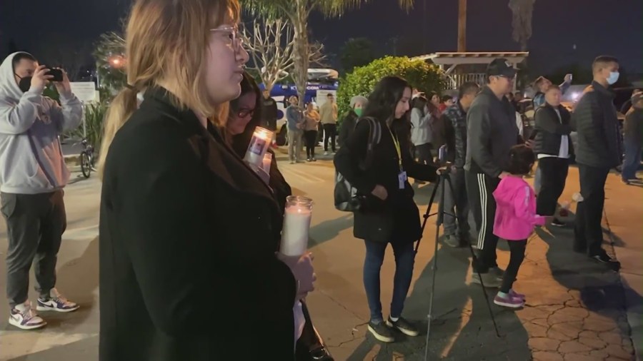 A community held a candlelight vigil outside the Star Ballroom Dance Studio in Monterey Park to remember loved ones lost during a mass shooting. (KTLA)