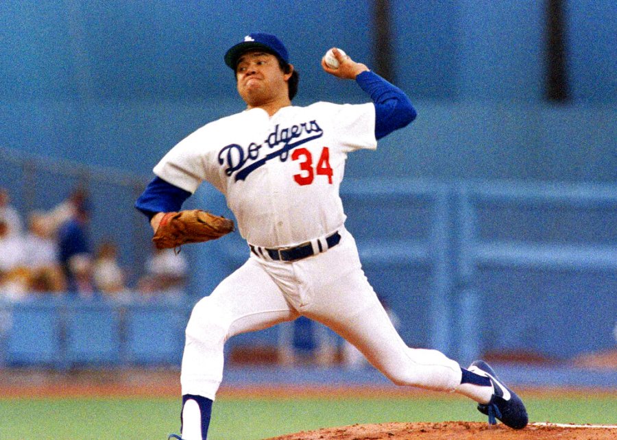 Los Angeles Dodgers pitcher Fernando Valenzuela prepares to release the ball in the first inning of the opening game of the National League Championship series against the St. Louis Cardinals, Oct. 9, 1985, in Los Angeles. The Dodgers will retire the No. 34 jersey of Valenzuela during a three-day celebration this summer. (AP Photo/Lennox McLendon, File)