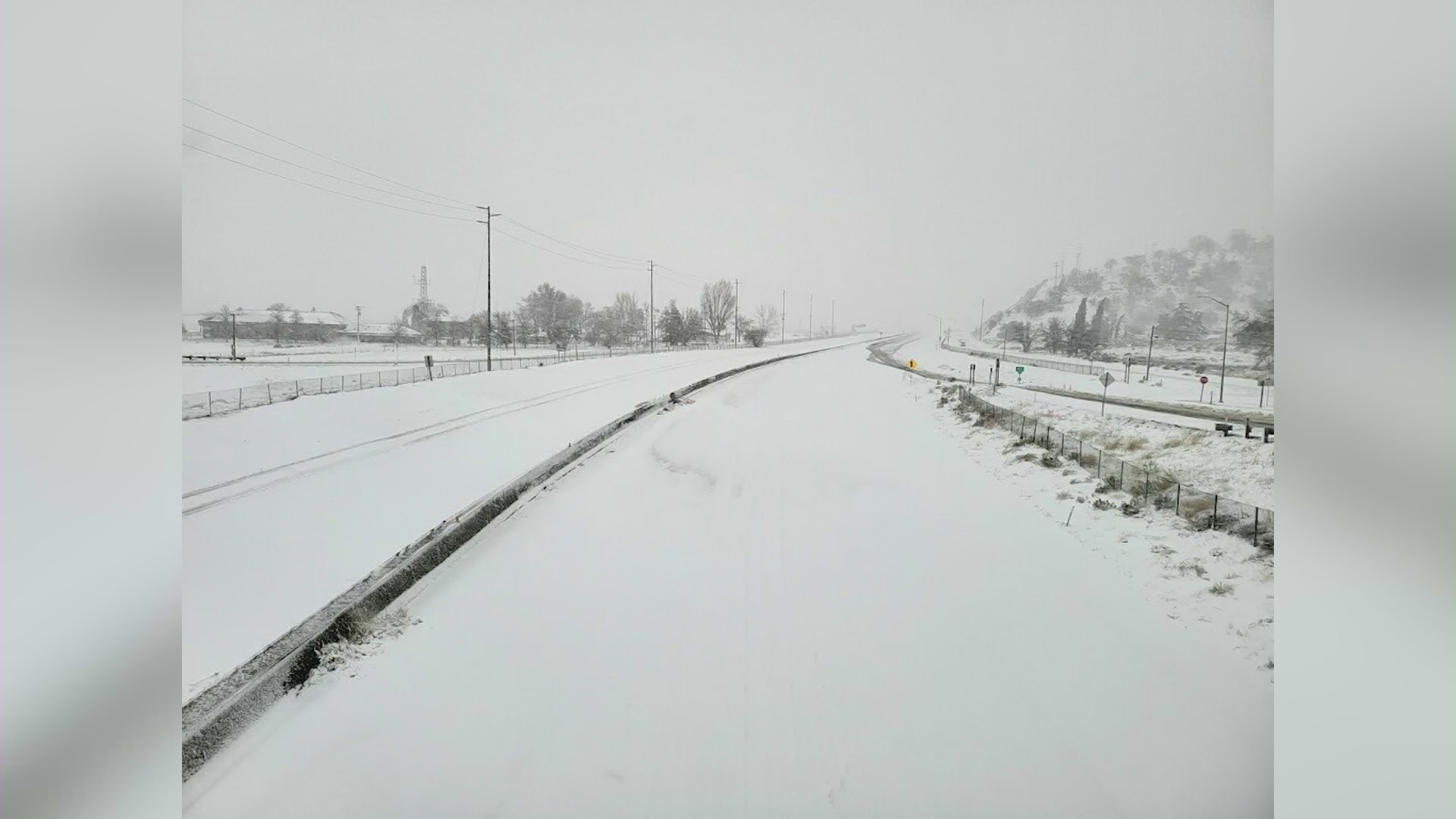 This photo from Caltrans shows a snowy scene in Southern California on Feb. 24, 2023.