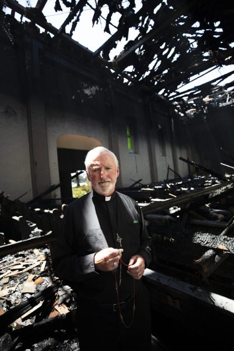 Bishop David O'Connell, auxiliary bishop for the San Gabriel Pastoral Region, visits the damaged San Gabriel Mission church the afternoon of Saturday, July 11, 2020. He also prayed with grieving parishioners. (Victor Alemán/Angelus News)