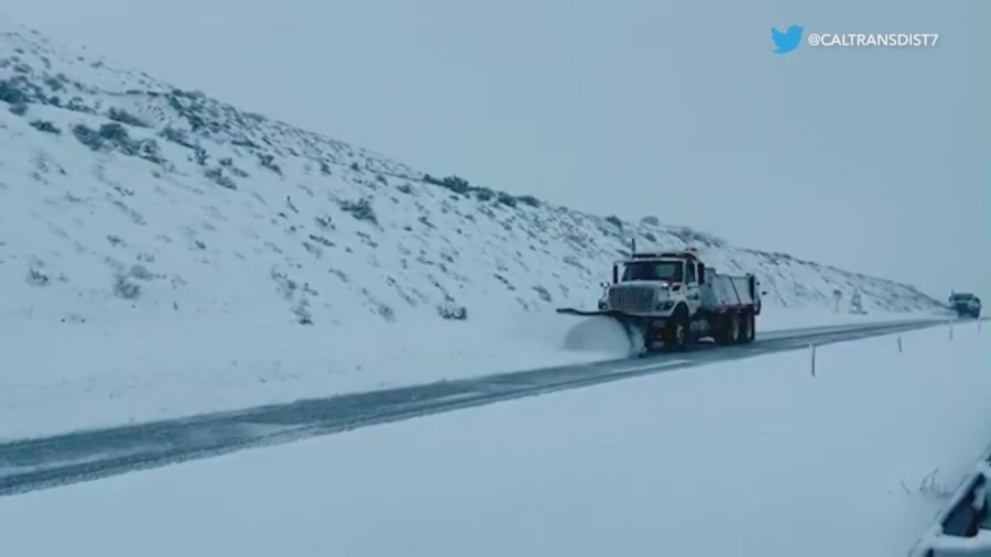 Snowplows clearing snow from the Grapevine as a winter storm batters Southern California.