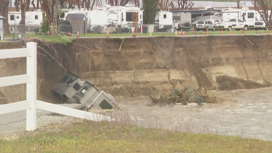 An RV tumbled off an embankment and into a river in Castaic on Feb. 25, 2023. (KTLA)