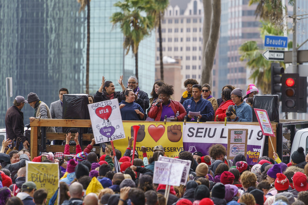 Union leaders address thousands of Los Angeles Unified School District teachers and Service Employees International Union 99 members during a rally outside the LAUSD headquarters in Los Angeles Tuesday, March 21, 2023. Thousands of service workers backed by teachers began a three-day strike against the Los Angeles Unified School District on Tuesday, shutting down education for a half-million students in the nation's second-largest school system. (AP Photo/Damian Dovarganes)