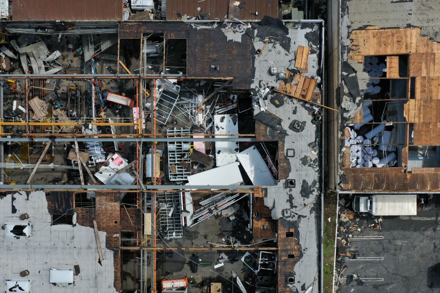 An aerial image shows damage to the roofs of industrial buildings from a tornado during a storm in Montebello on March 23, 2023. (Patrick T. Fallon / AFP via Getty Images)