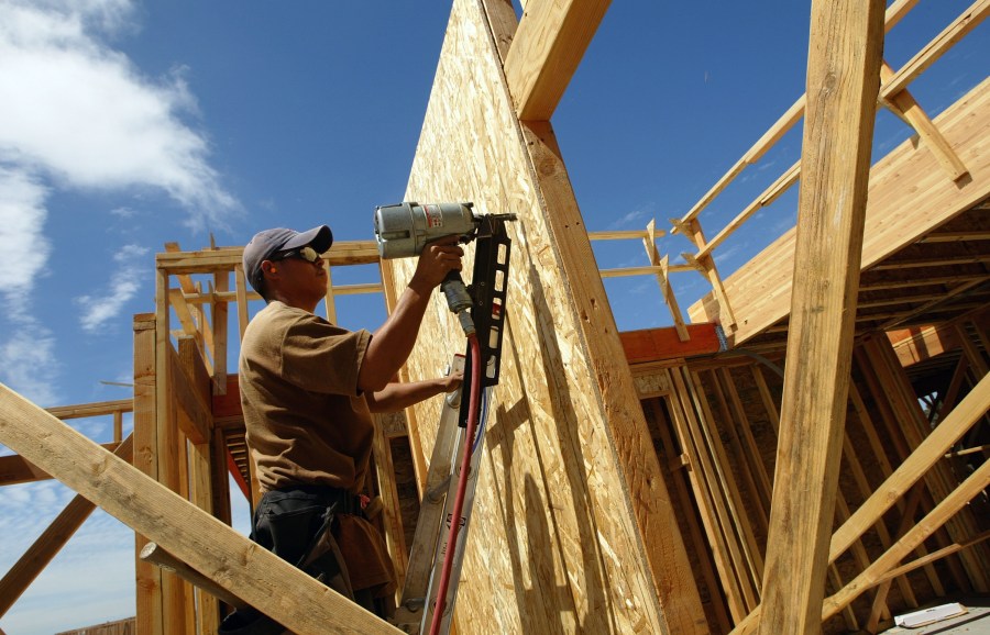 A construction worker works on the framing of a new home August 19, 2003 in Rodeo, California. (Justin Sullivan/Getty Images)