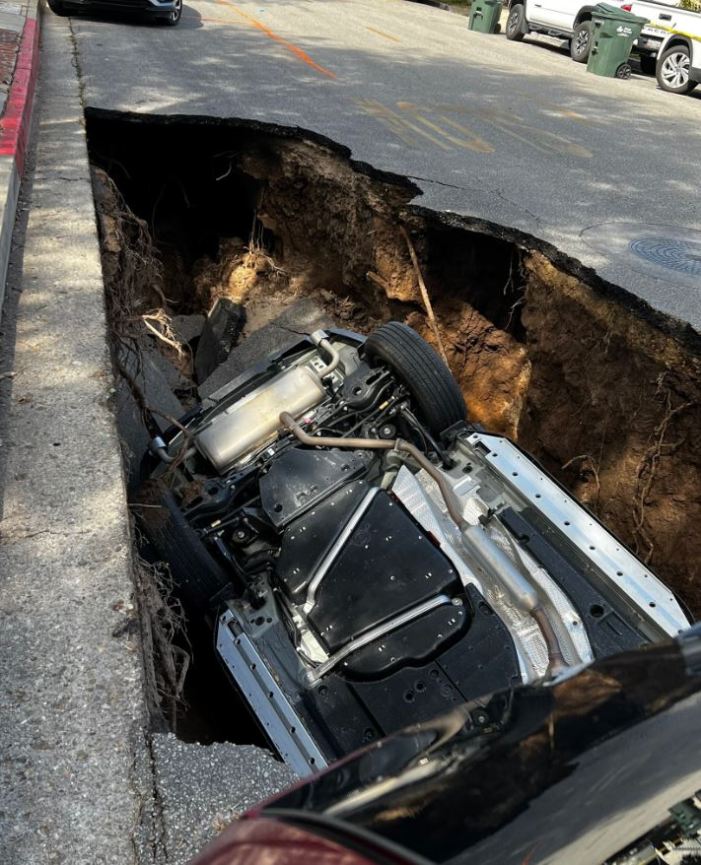 A large sinkhole swallowed a vehicle at a Ventura County school campus on March 1, 2023. (Ventura County Fire)