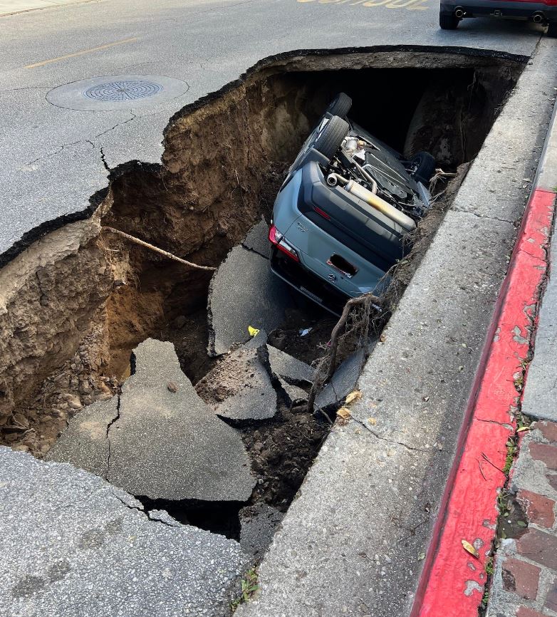 A large sinkhole swallowed a vehicle at a Ventura County school campus on March 1, 2023. (Ventura County Fire)