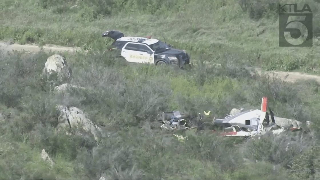 A Riverside County Sheriff's Department vehicle blocks the area where a helicopter crashed in Perris, killing two people on March 24, 2023. (KTLA)