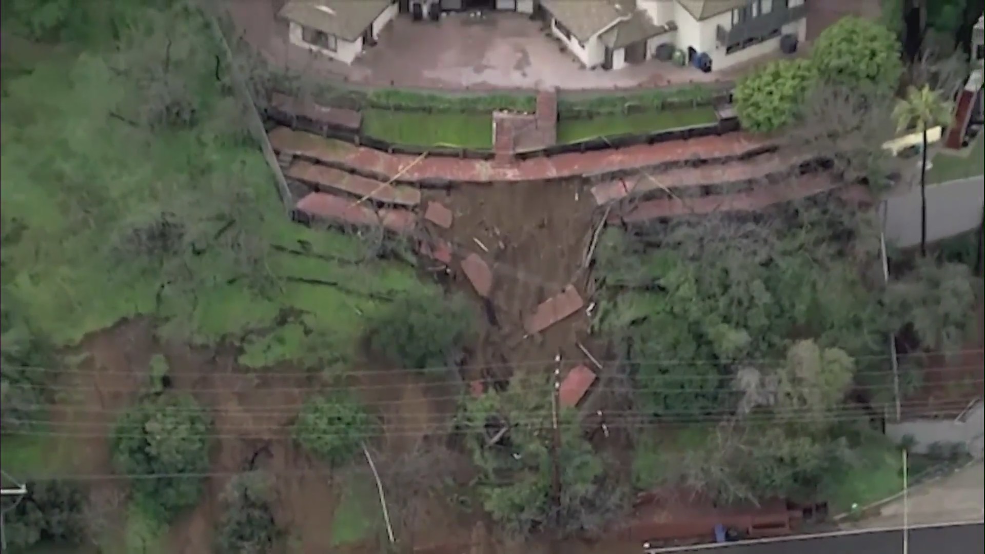 Stormy weather across Southern California continued causing destruction on Wednesday, downing trees and powerlines while causing sinkholes and mudslides. (KTLA)