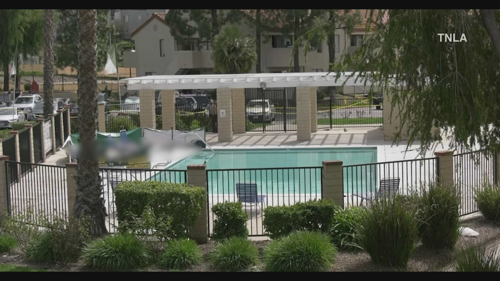 Two people were fatally shot while sitting by the pool in a Newhall apartment complex on March 18, 2023. (TNLA)