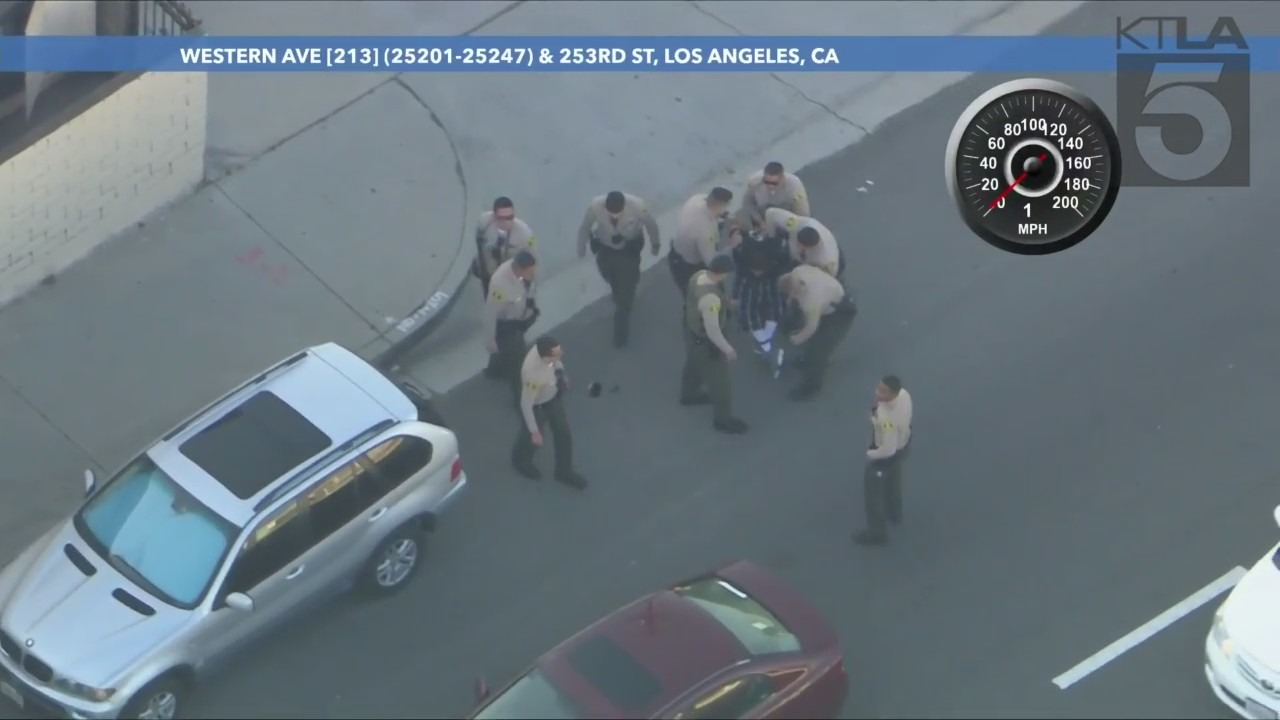 Suspect being hog tied during his arrest following a high-speed chase in L.A. County. (KTLA)