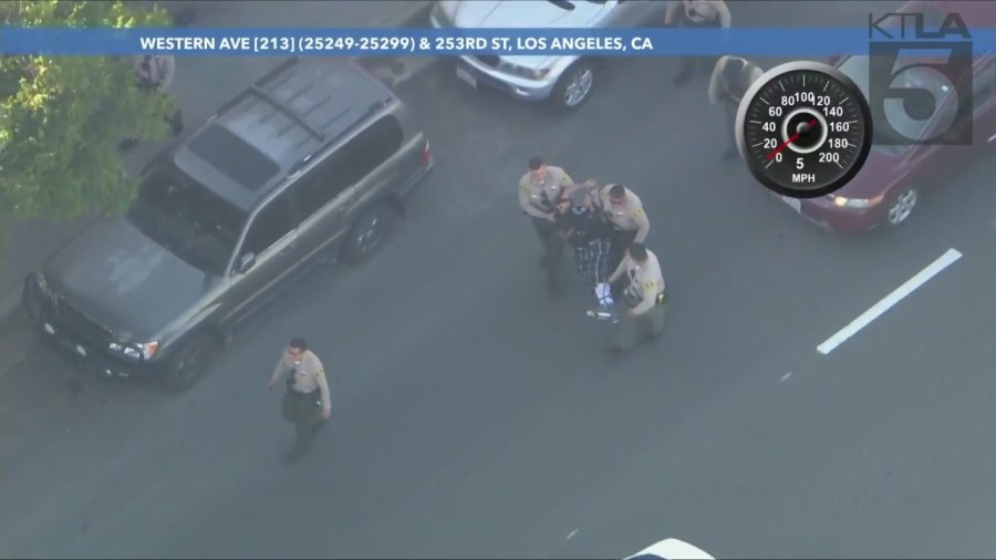 Suspect being hog tied during his arrest following a high-speed chase in L.A. County. (KTLA)