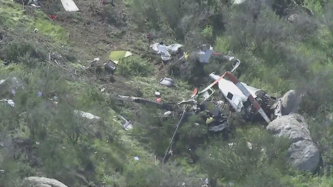 The scene of a helicopter crash that killed two people in a remote area just east of Perris on March 24, 2023. (KTLA)