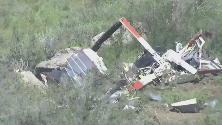 The scene of a helicopter crash that killed two people in a remote area just east of Perris on March 24, 2023. (KTLA)