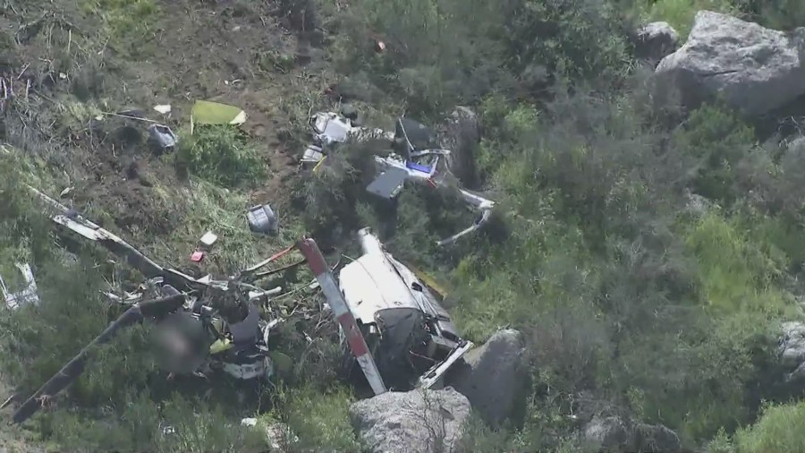 The scene of a helicopter crash that killed two people in a remote area just east of Perris on March 24, 2023. (KTLA)