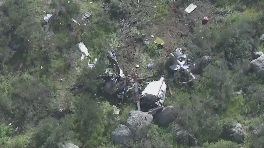 The scene of a helicopter crash that killed two people in a remote area just east of Perris on March 24, 2023. (KTLA)