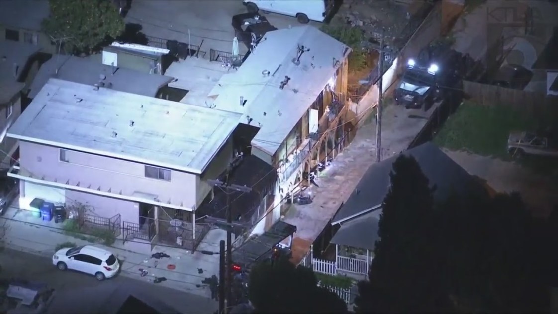 A SWAT vehicle blocks an alley in Lincoln Heights following a shootout with police on March 8, 2023. (KTLA)