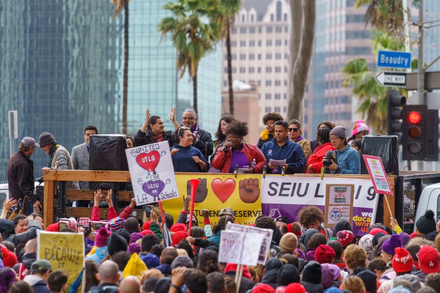 FILE - Union leaders address thousands of Los Angeles Unified School District teachers and Service Employees International Union 99 members during a rally outside the LAUSD headquarters in Los Angeles on March 21, 2023. In an agreement announced Saturday, April 8, Los Angeles Unified School District workers approved a labor deal following a massive three-day strike over wages and staffing that halted education for students in one of the nation's largest school systems. (AP Photo/Damian Dovarganes, File)