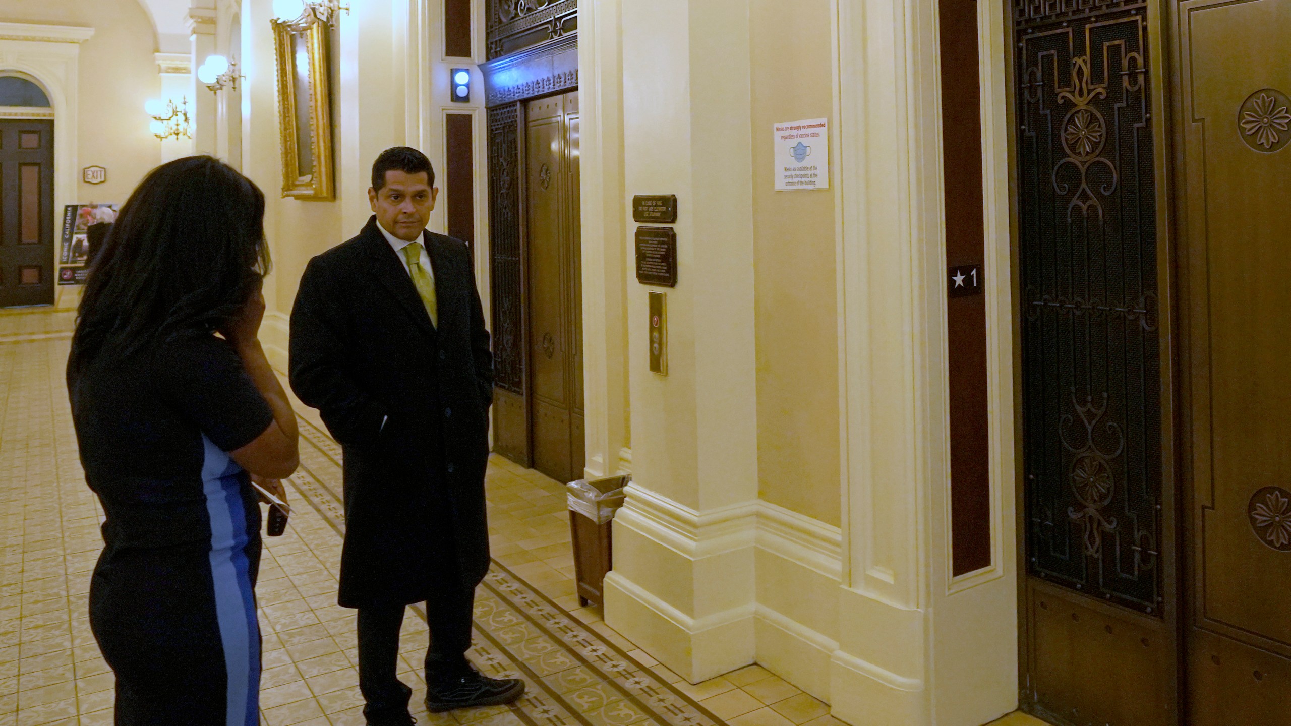 Democratic Assemblyman Miguel Santiago, waits for an elevator in the nearly empty state Capitol after a "credible threat" forced California lawmakers out of the building In Sacramento, Calif., Thursday April 13, 2023. State Senate officials say they were notified about the threat by the California Highway Patrol, which declined to comment further. (Photo/Rich Pedroncelli)