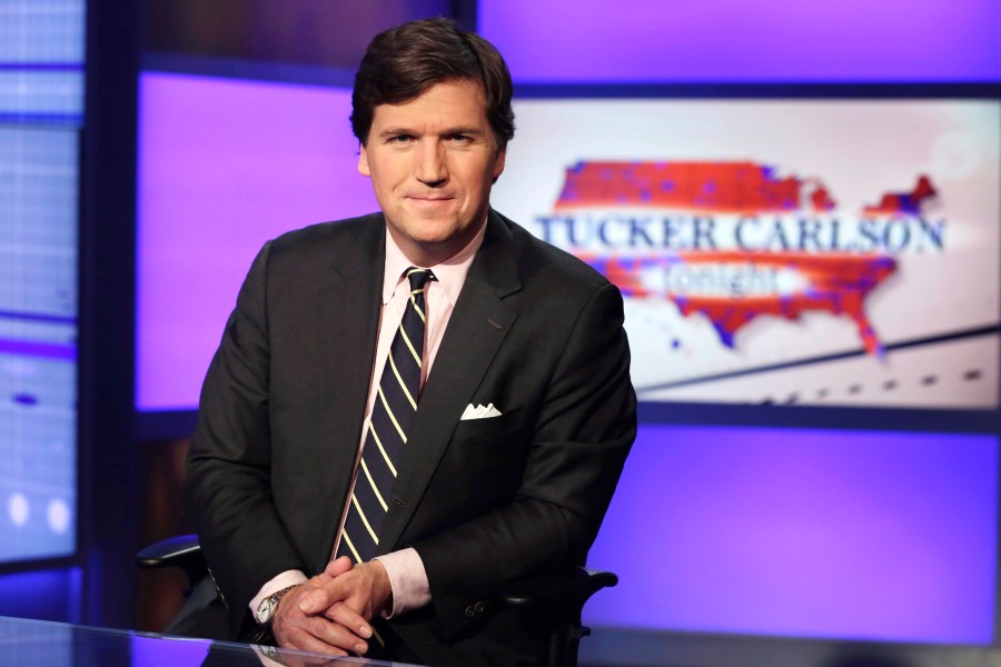 Tucker Carlson, host of "Tucker Carlson Tonight," poses for photos in a Fox News Channel studio on March 2, 2017, in New York. (AP Photo/Richard Drew, File)