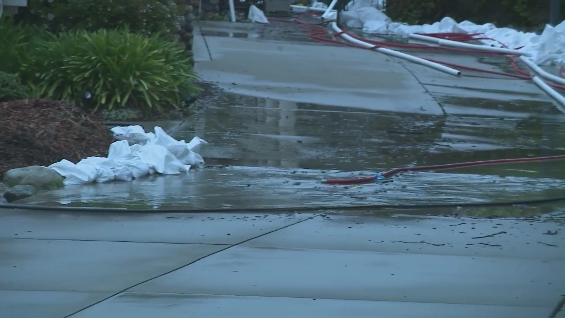 Claremont homeowners work to divert flooding from rising groundwater on April 13, 2023. (KTLA)