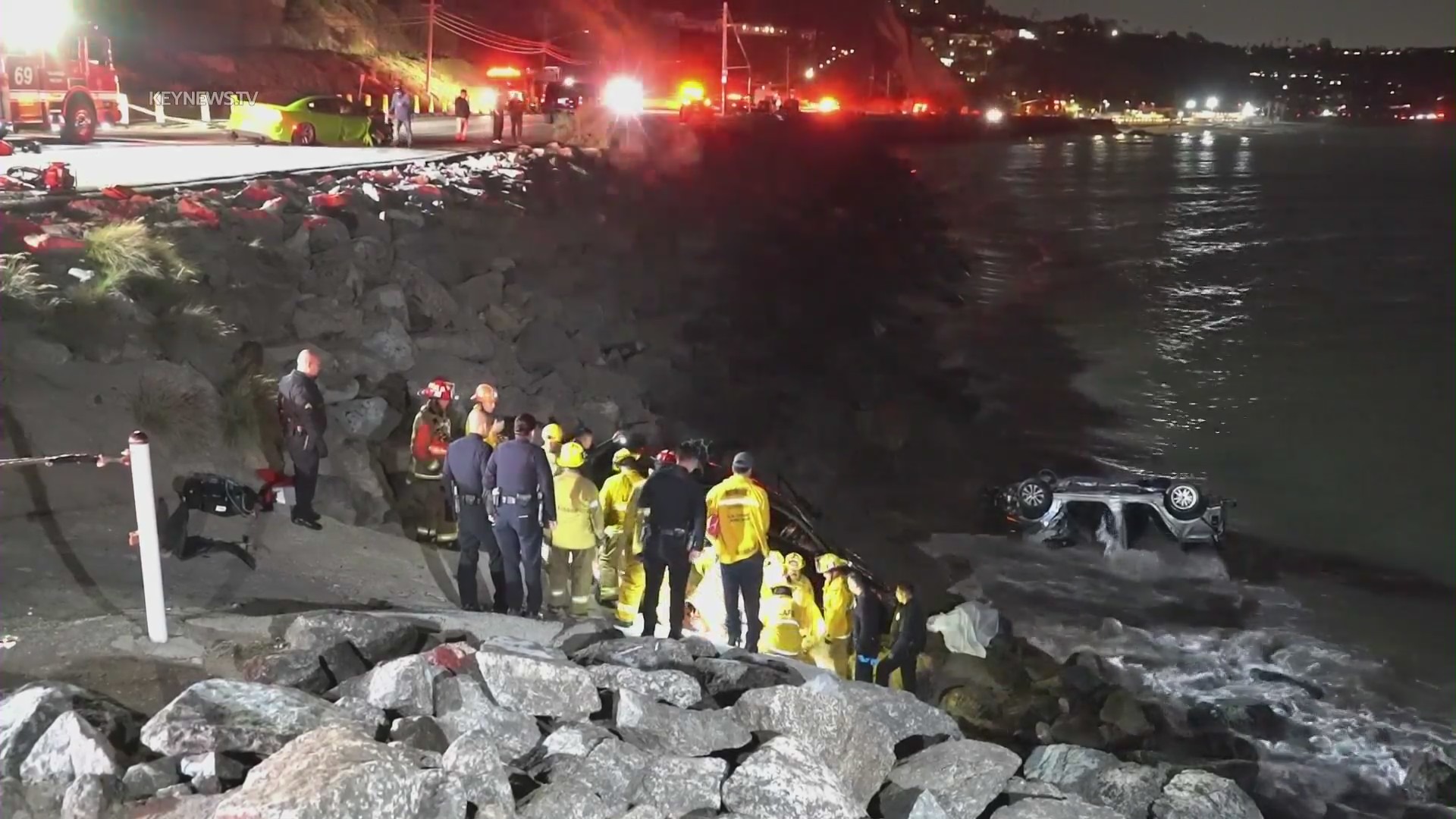 A driver allegedly under the influence smashed into parked cars along PCH on April 8, 2023, sending them careening toward pedestrians on the oceanside rocks below. (KeyNews.TV)