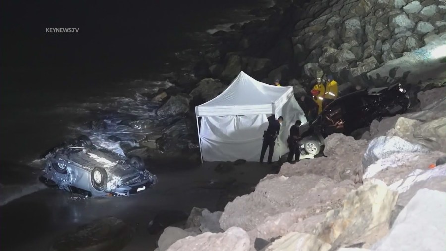 A driver allegedly under the influence smashed into parked cars along PCH on April 8, 2023, sending them careening toward pedestrians on the oceanside rocks below. (KeyNews.TV)