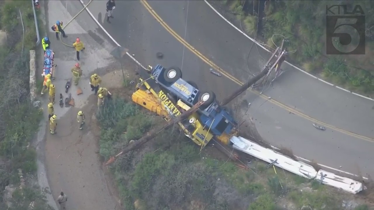 The driver of a crane vehicle was killed after crashing into a power pole in Malibu on April 5, 2023. (KTLA)