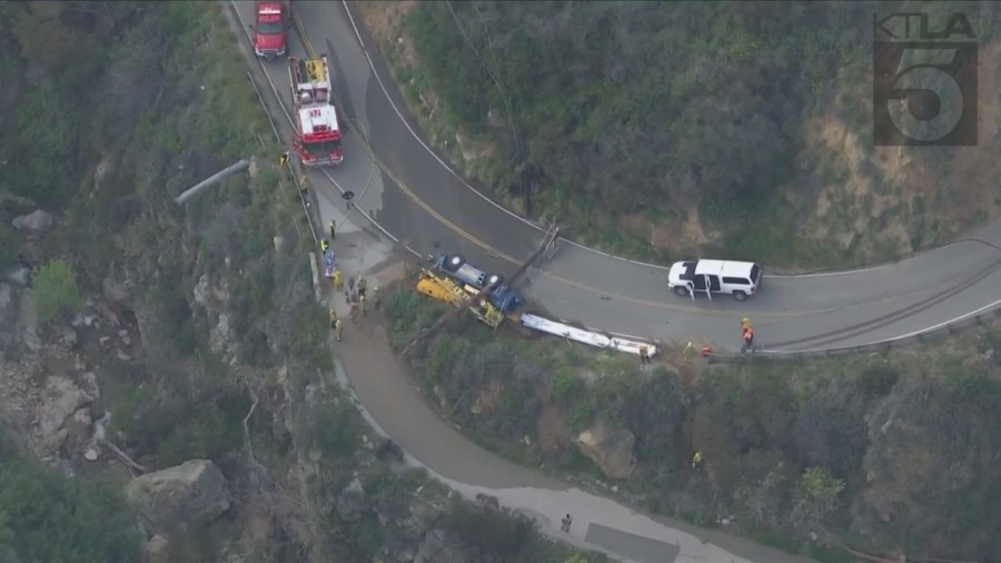 The driver of a crane vehicle was killed after crashing into a power pole in Malibu on April 5, 2023. (KTLA)