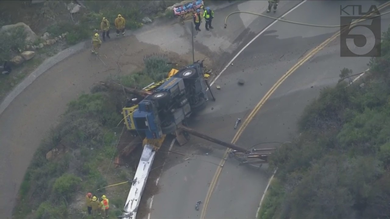 The driver of a crane vehicle was killed after crashing into a power pole in Malibu on April 5, 2023. (KTLA)