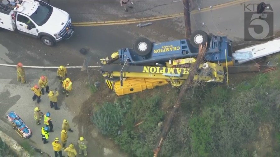 The driver of a crane vehicle was killed after crashing into a power pole in Malibu on April 5, 2023. (KTLA)