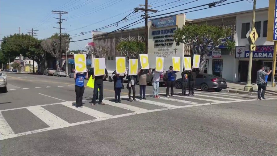 Rally held by residents on April 8, 2023 calling for safer streets after a hit-and-run crash left a 13-year-old boy without a leg in Boyle Heights. (KTLA)