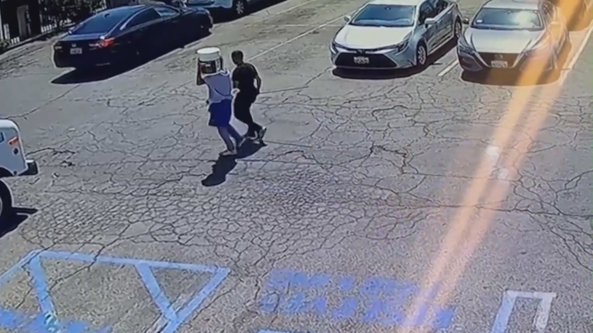 Security video shows two victims entering a shop and offering to paint over graffiti just moments before they were shot in Northridge on April 15, 2023. (Northridge Ice Cream)