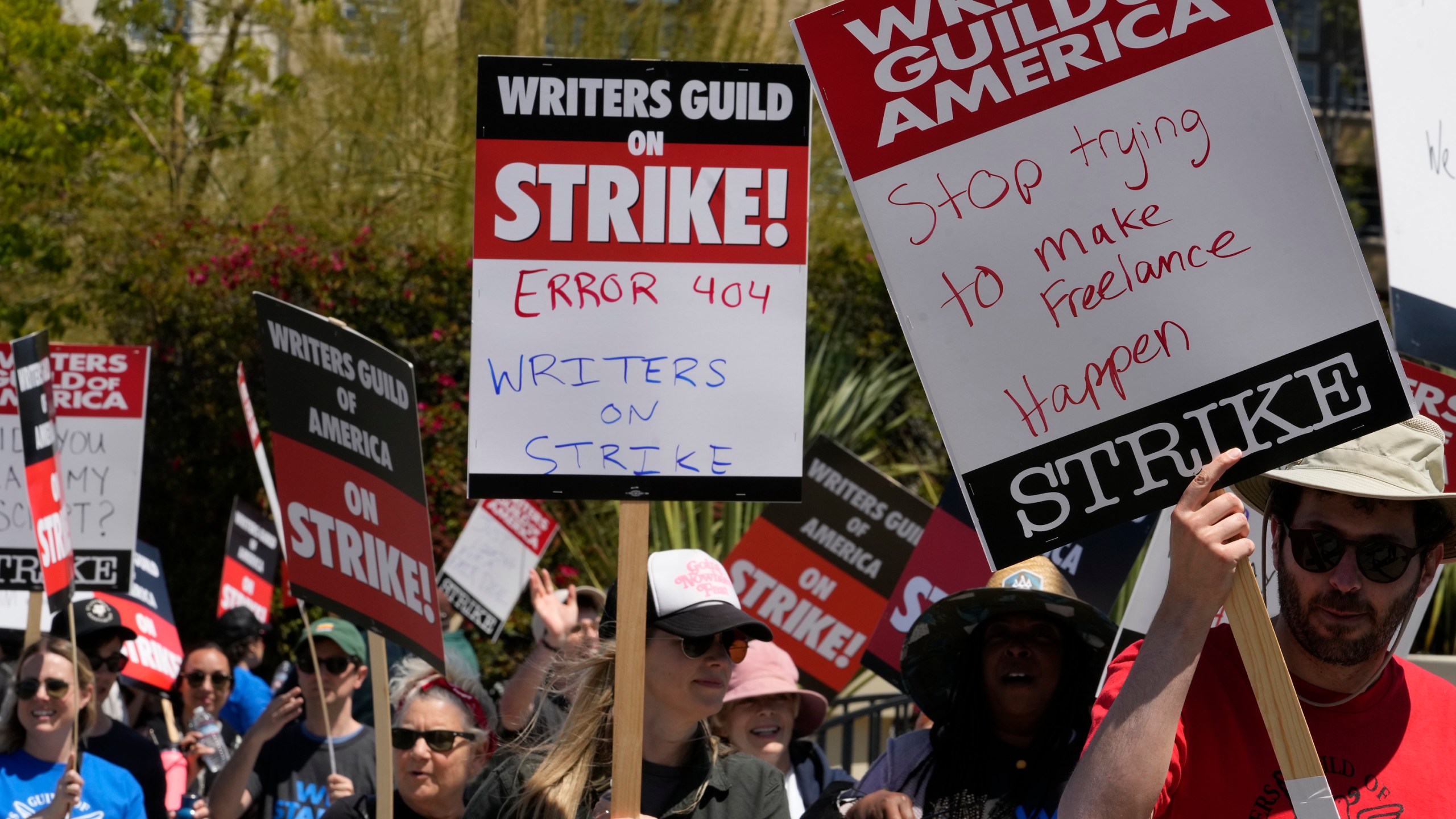 Members of the Writers Guild of America picket outside CBS Television City in the Fairfax District of Los Angeles Tuesday, May 2, 2023. (AP Photo/Damian Dovarganes)