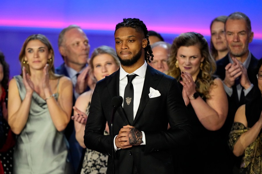 FILE - Buffalo Bills' Damar Hamlin speaks in front of University of Cincinnati Medical Center staff during the NFL Honors award show ahead of the Super Bowl 57 football game, Thursday, Feb. 9, 2023, in Phoenix.  (AP Photo/David J. Phillip, File)