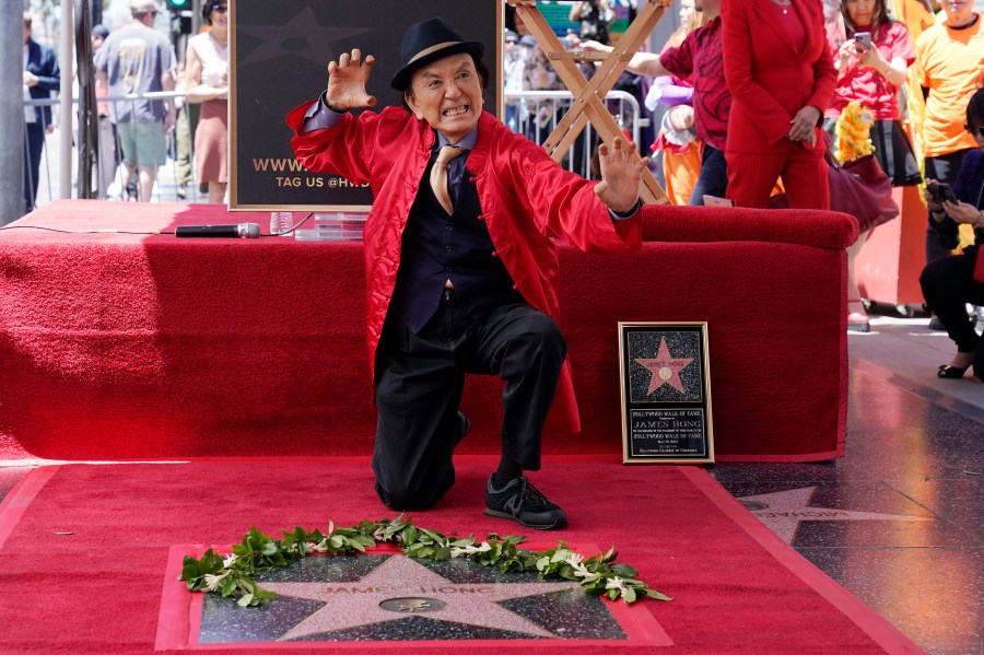 FILE - Actor James Hong poses after being honored with a star on the Hollywood Walk of Fame on May 10, 2022, in the Hollywood section of Los Angeles. has a starring role in the new “Gremlins” animated prequel, “Secrets of the Mogwai,” and pops up in “American Born Chinese” on Disney+. (AP Photo/Mark J. Terrill, File)