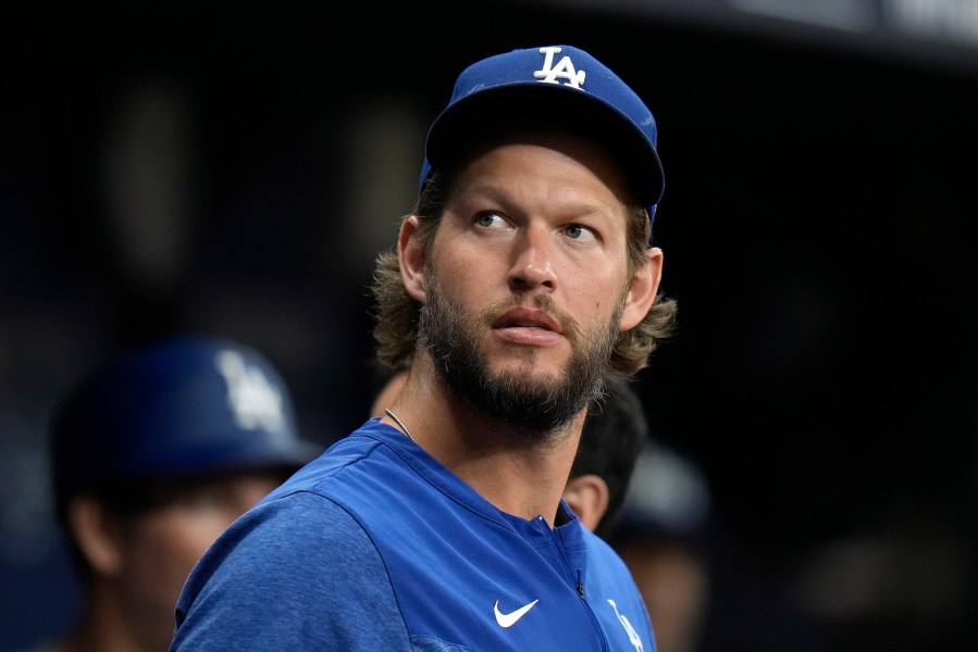 Los Angeles Dodgers starting pitcher Clayton Kershaw looks out of the dugout during the first inning of a baseball game against the Tampa Bay Rays Friday, May 26, 2023, in St. Petersburg, Fla. (AP Photo/Chris O'Meara)