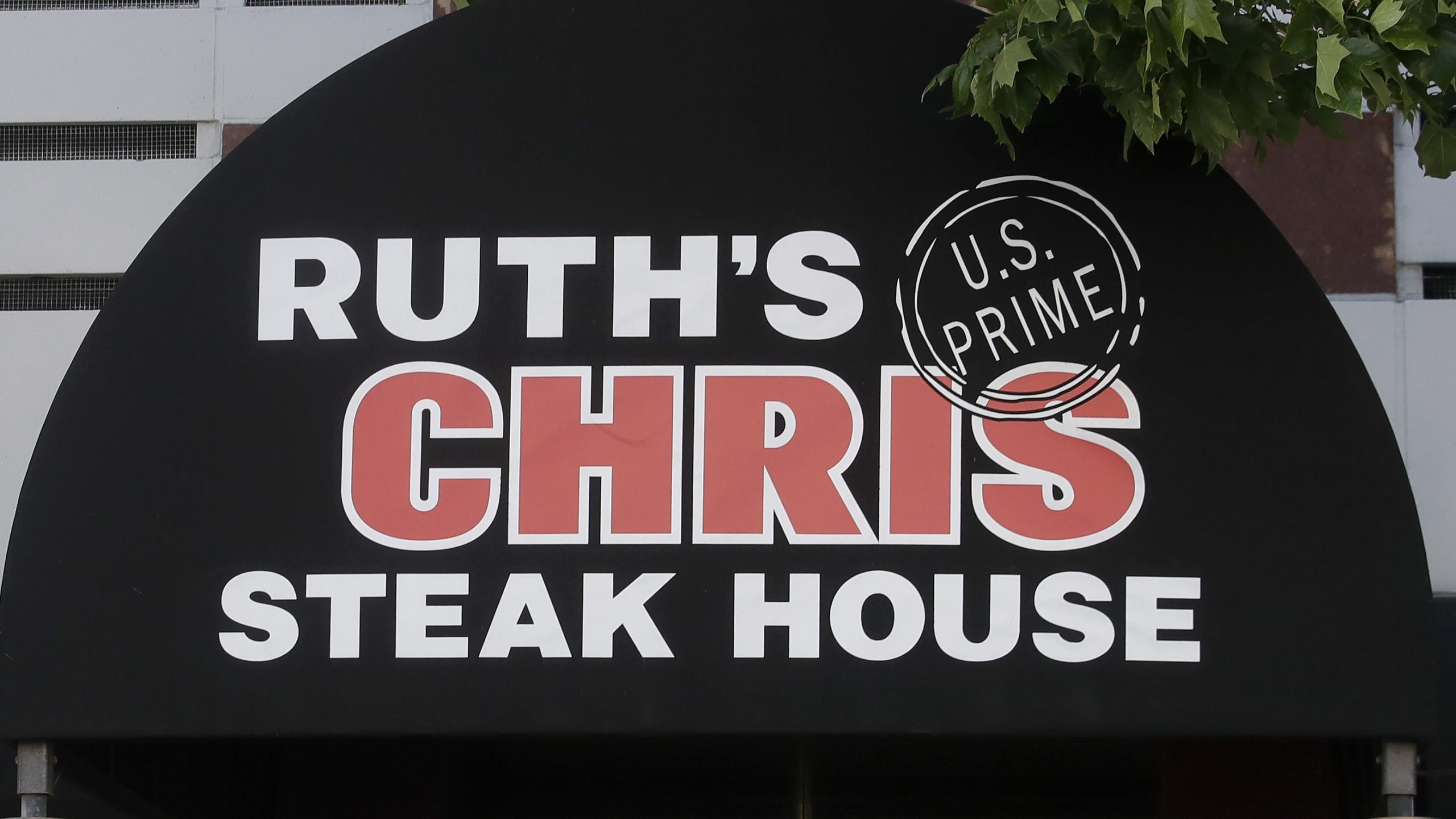 A Ruth's Chris Steak House sign is shown in San Francisco on April 21, 2020. (Jeff Chiu/Associated Press)