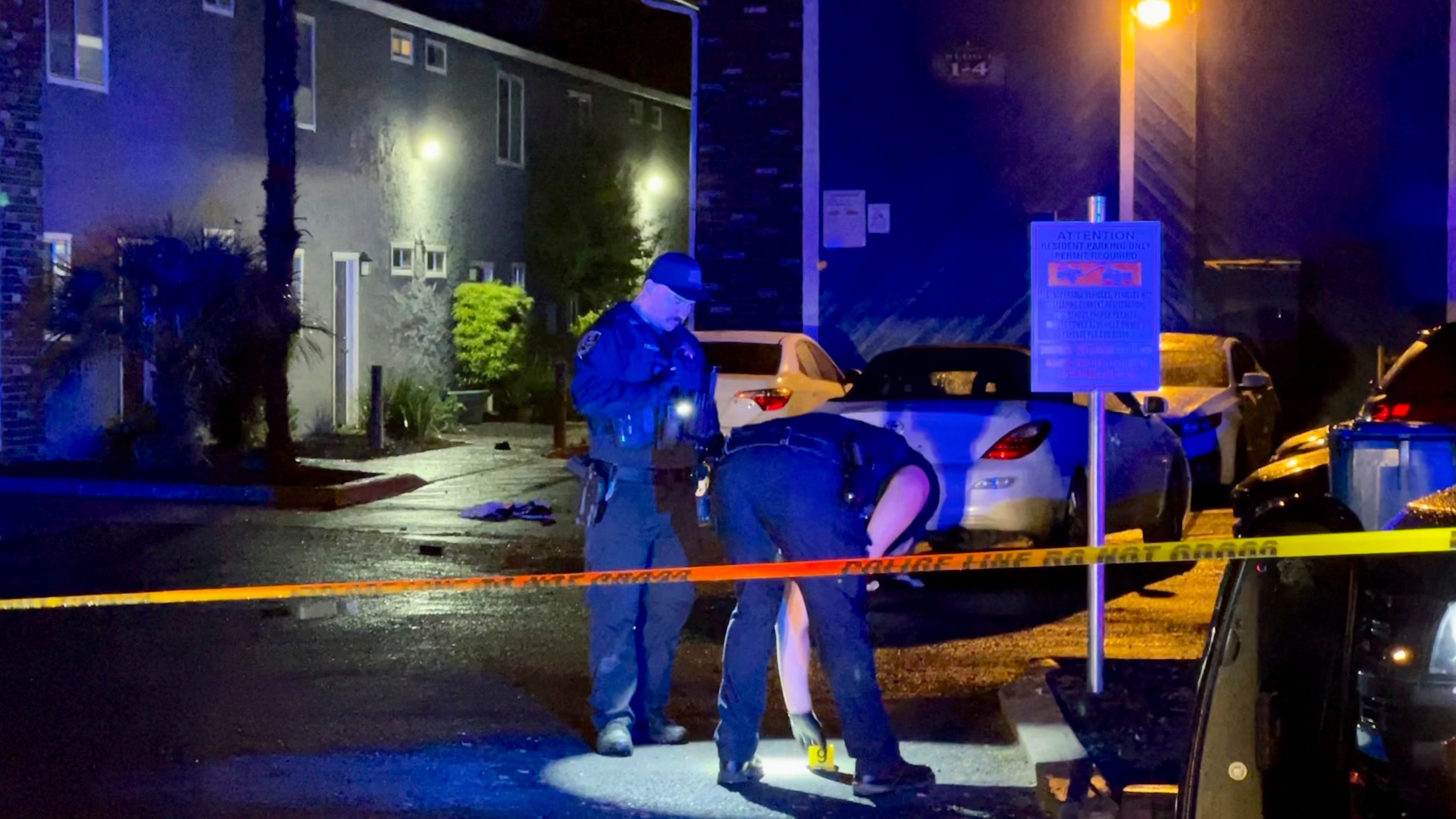 Police investigate an incident on Columbus Avenue connected to another on West Seventh Street after midnight, Saturday, May 6, 2023, in Chico, Calif. Officials say officers responding around 3:30 a.m. Saturday to reports of gunfire found six people shot at an apartment building. (Michael Weber/The Chico Enterprise-Record via AP)